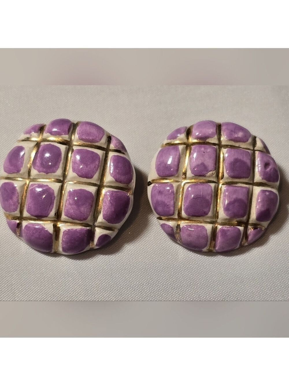 Vintage earrings with a purple enameled checkerboard pattern